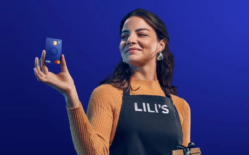 Tide business account — UK founder holding Tide card